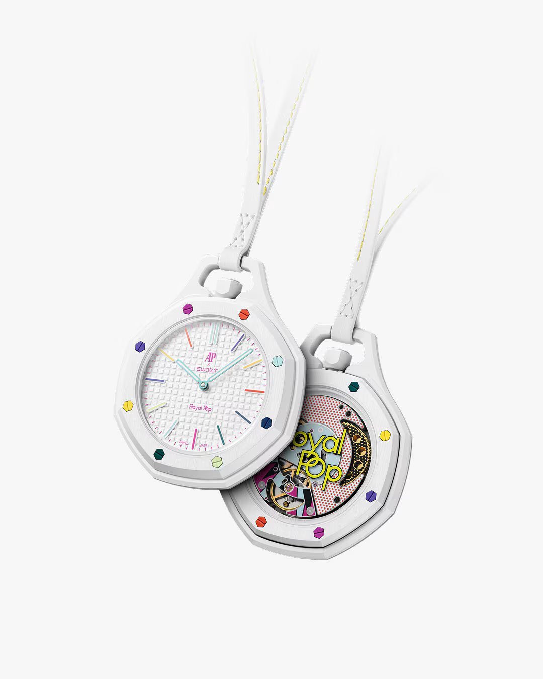 Two white digital watches with colorful markers and cords, one showing clock face and one showing internal mechanism